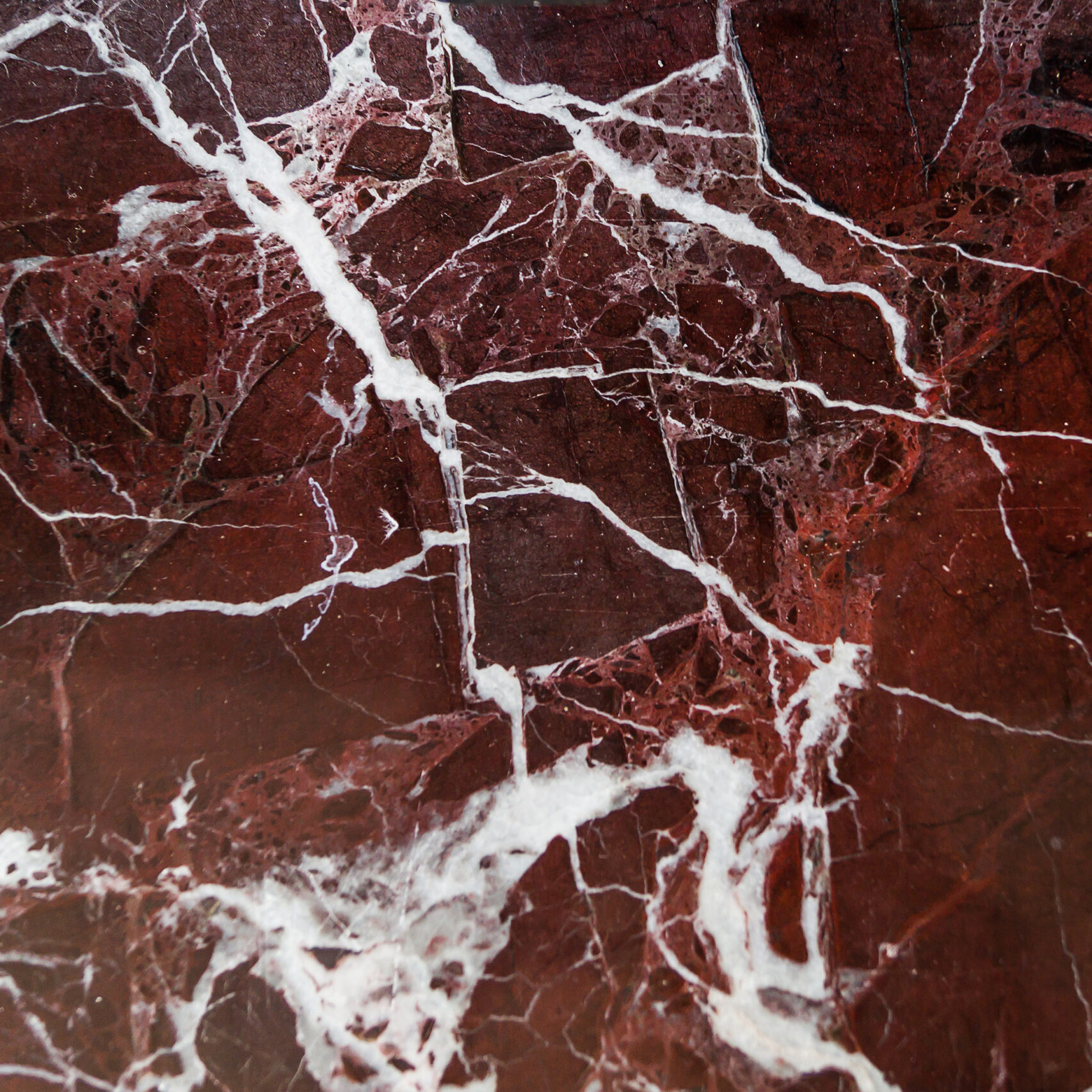 Dark red marble as a background, texture